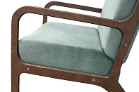 Низкое кресло с деревянными подлокотниками Mody Green в интерьере в Краснодаре